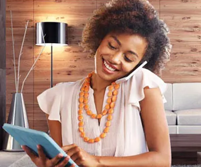 Women on cell phone in home